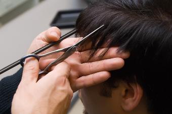 Image of a man getting his hair cut